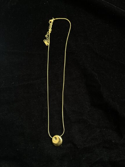 Gold metal G logo necklace